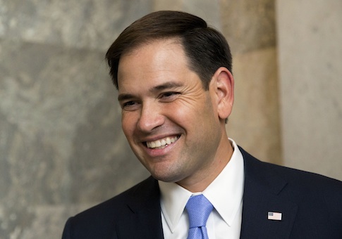 Sen. Marco Rubio, R-Fla. smiles while speaking with a reporter on Capitol Hill in Washington, Tuesday, Nov, 5 2013, before attending a Republican policy luncheon. (AP Photo/Jacquelyn Martin)